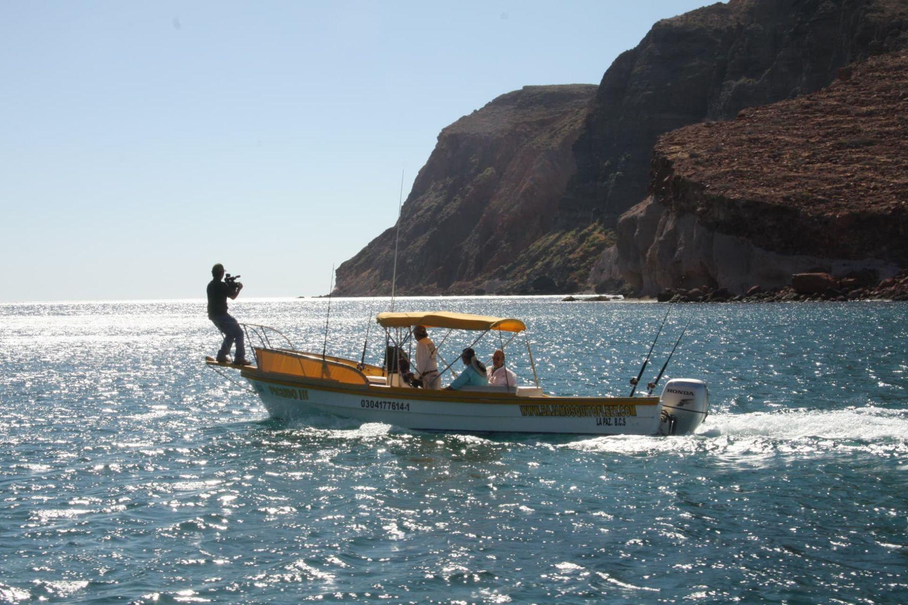Picudo III below the cliffs — Baja Mosquito Fleet, La Paz